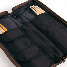 Load image into Gallery viewer, SABIAN Arena stick bag in black with brown accents holding drumsticks and accessories
